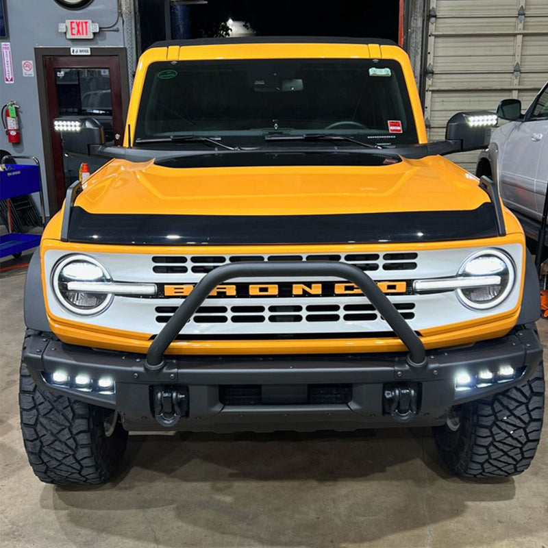 Load image into Gallery viewer, Front view of orange bronco with side mirrors and triple fog lights illuminating