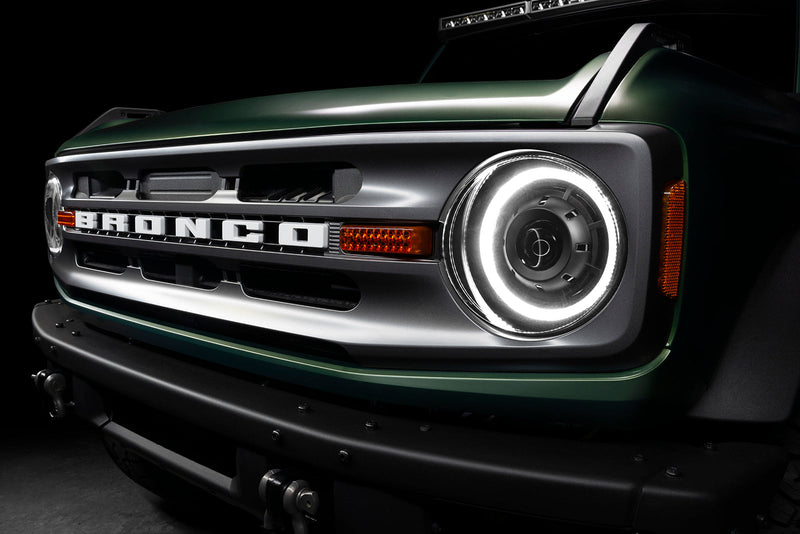Load image into Gallery viewer, Close-up of ford bronco with Oculus headlights turned on - white DRL