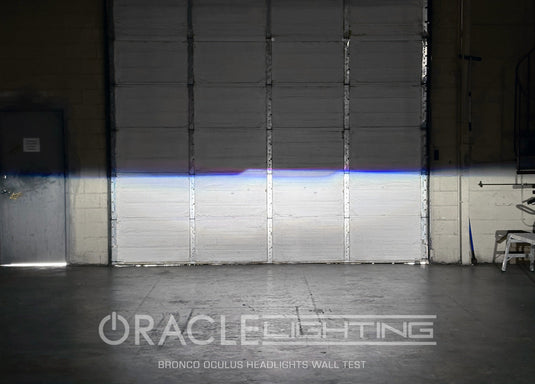Garage door from the drivers point of view, with headlights on and a sharp cutoff line